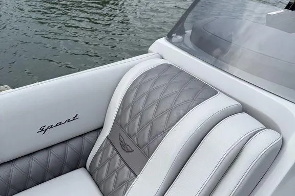 Slide: The Image of 2026 Bennington RX Sport Quad Bench 23 RXFB with luxurious quilted seating on water. - 9