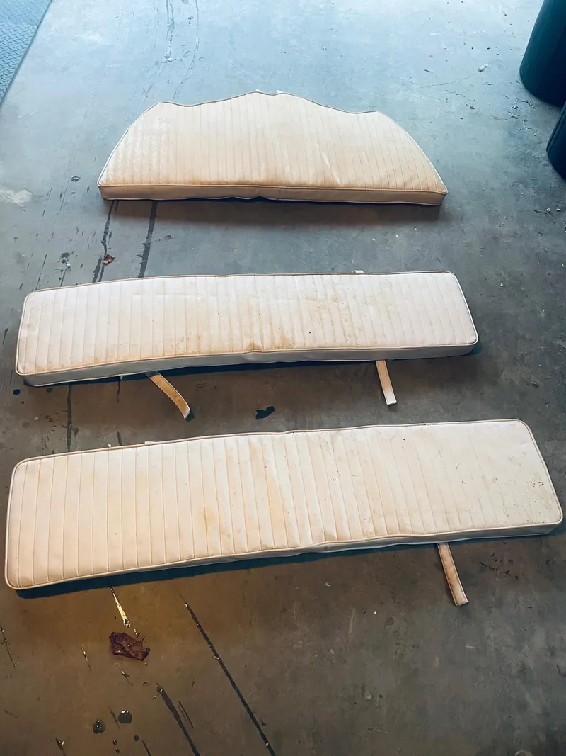Slide: The Image of Cushions for 1991 Boston Whaler 13 boat, displayed on a concrete floor. - 8