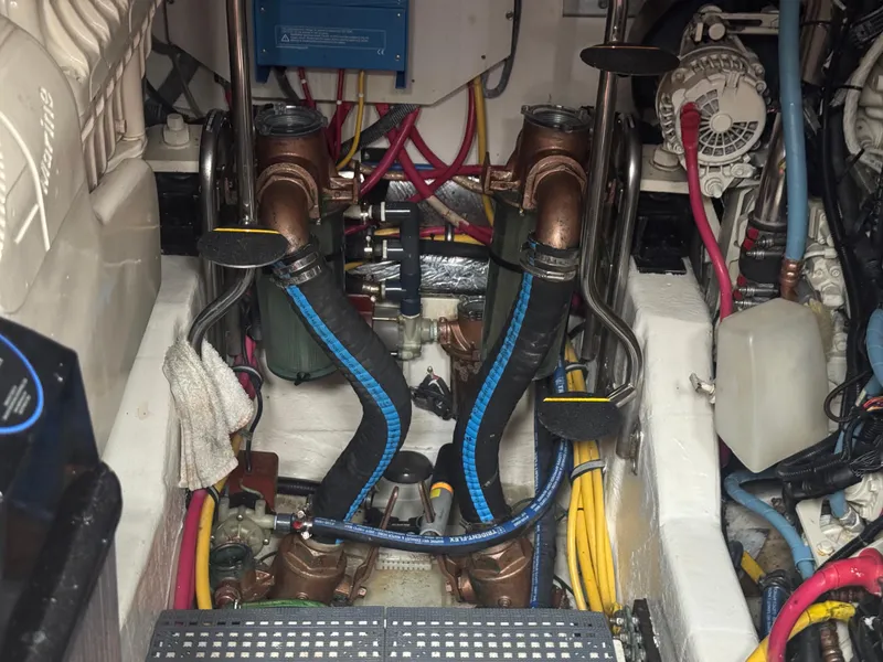 Slide: The Image of Engine room of a 2006 Tiara Yachts 4200 Open, showcasing mechanical components and wiring. - 13