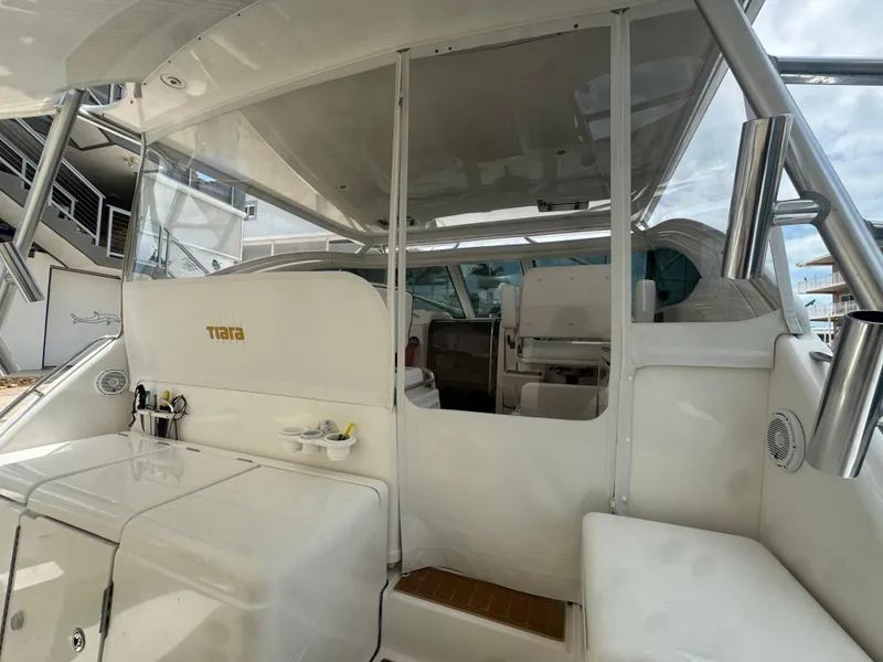 Slide: The Image of 2006 Tiara Yachts 4200 Open cockpit with seating and storage, showcasing luxury design. - 16
