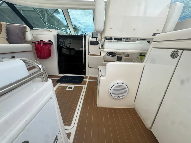 Slide: The Image of 2006 Tiara Yachts 4200 Open interior with seating and wooden flooring. - 17