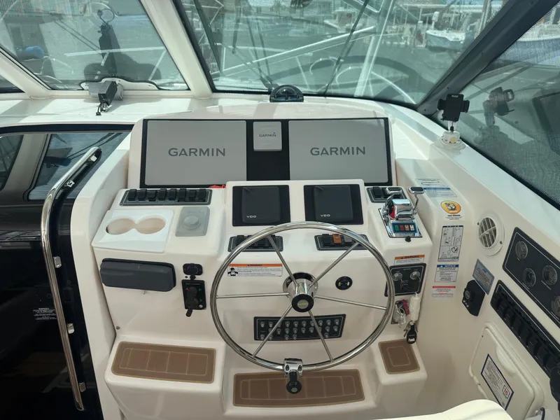 Slide: The Image of Cockpit of 2006 Tiara Yachts 4200 Open with Garmin navigation system and steering wheel. - 19