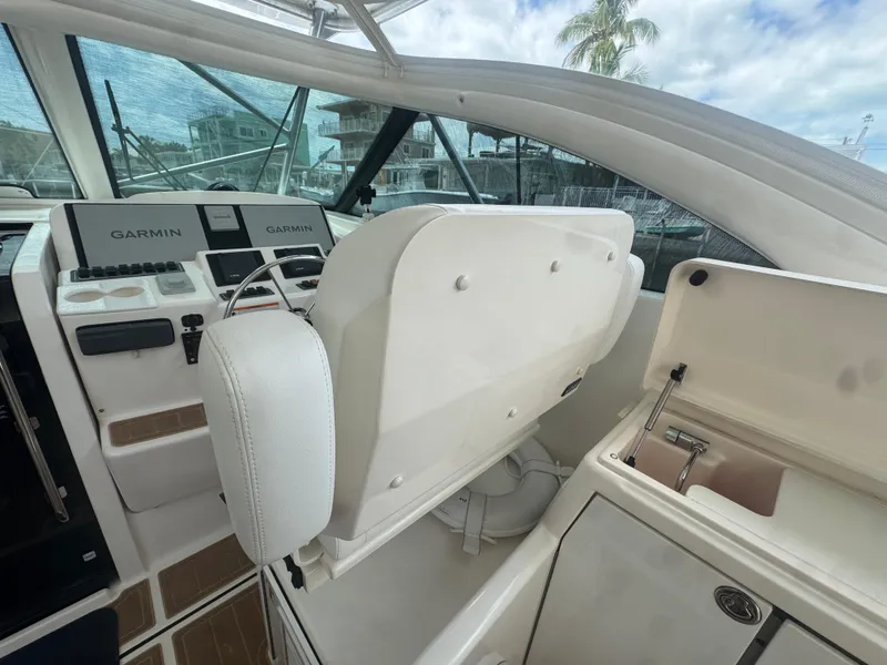 Slide: The Image of 2006 Tiara Yachts 4200 Open helm with Garmin navigation and storage compartment. - 22