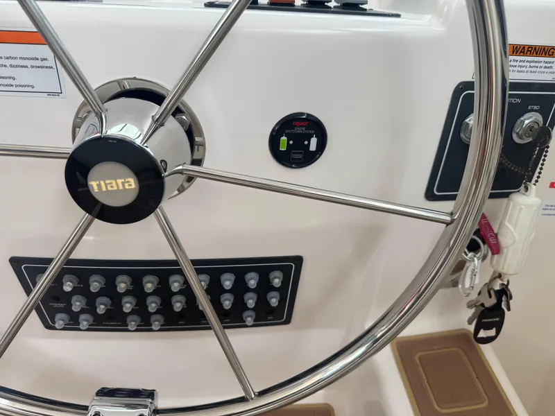 Slide: The Image of Steering wheel and control panel of 2006 Tiara Yachts 4200 Open boat. - 29