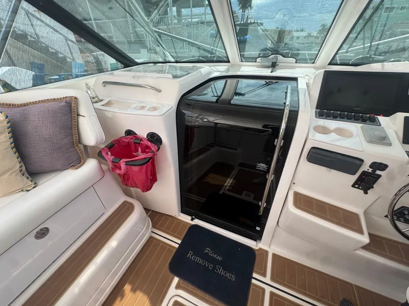 Slide: The Image of 2006 Tiara Yachts 4200 Open interior with seating, helm, and cabin entrance. - 31