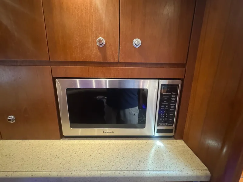 Slide: The Image of Microwave in 2006 Tiara Yachts 4200 Open, set in wooden cabinetry. - 36