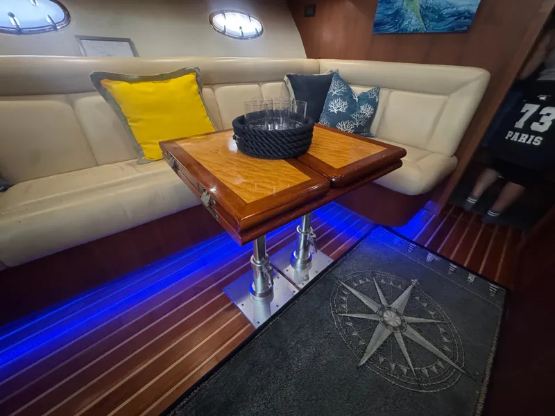 Slide: The Image of Interior of 2006 Tiara Yachts 4200 Open with cozy seating and nautical decor. - 39