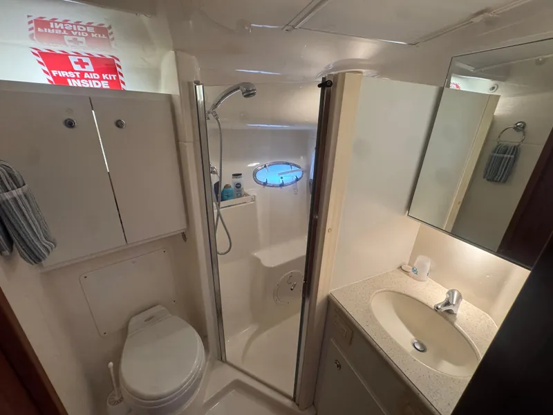 Slide: The Image of 2006 Tiara Yachts 4200 Open bathroom with shower, sink, and toilet. - 40