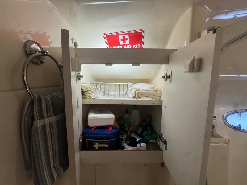 Slide: The Image of Cabinet with first aid kit and toiletries on a 2006 Tiara Yachts 4200 Open. - 42