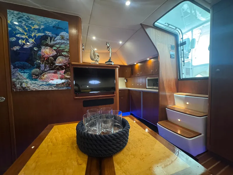 Slide: The Image of Luxurious interior of 2006 Tiara Yachts 4200 Open with elegant wood finishes and marine decor. - 48