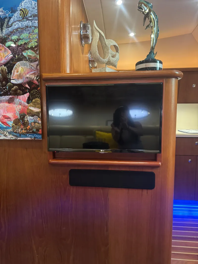 Slide: The Image of Interior of 2006 Tiara Yachts 4200 Open with TV and marine decor. - 49