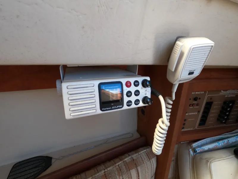 Slide: The Image of VHF radio and microphone in a 1985 Catalina 27 sailboat cabin. - 10