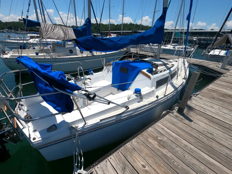 Slide: The Image of 1985 Catalina 27 sailboat docked with blue covers, sunny day. - 4