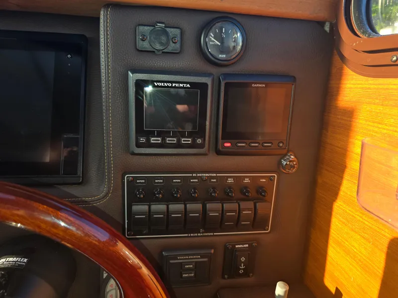 Slide: The Image of Control panel of a 2017 Ranger Tugs R-27 boat with navigation instruments. - 17