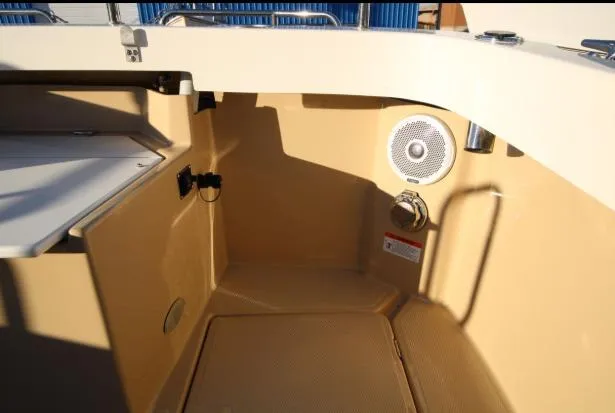 Slide: The Image of 2017 Ranger Tugs R-27 boat interior with speaker and storage area. - 42