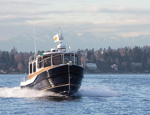 Slide: The Image of Manufacturer Provided Image: 2017 Ranger Tugs R-27 cruising on a lake with mountains in the background. - 49