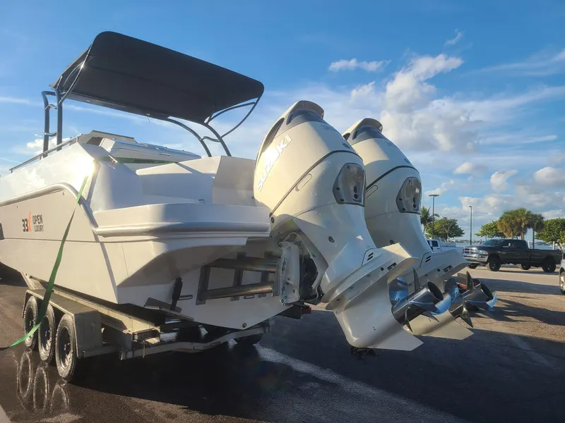 Slide: The Image of 2021 Giupex 33 boat, sleek design, docked near concrete wall, under blue sky. - 7