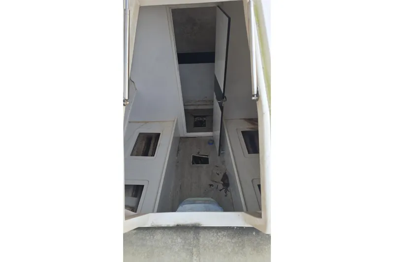Slide: The Image of Interior view of a 2021 Giupex 33 boat, showing cabin layout and storage compartments. - 9