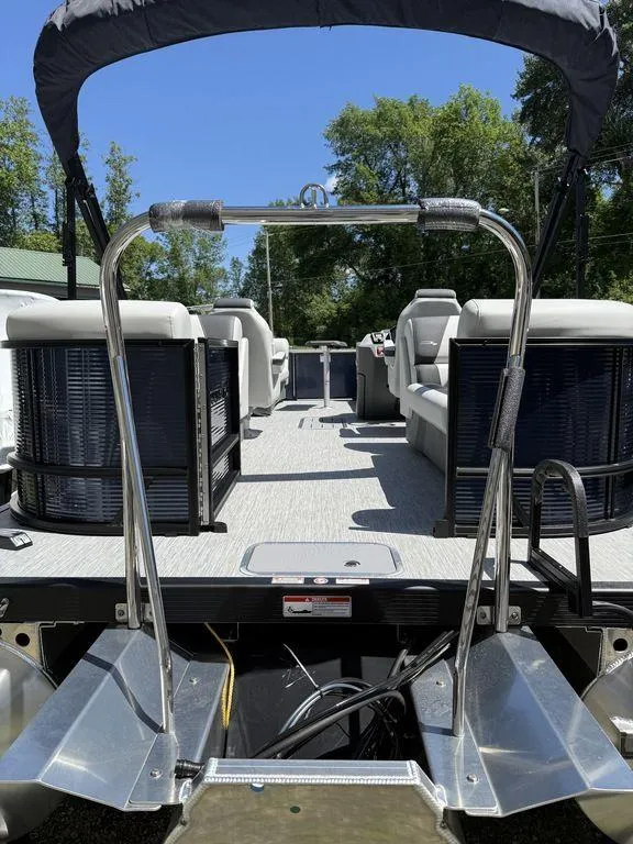 Slide: The Image of 2026 Bennington S Quad Bench 22 SSR pontoon boat with spacious seating and sleek design. - 13