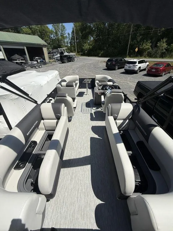 Slide: The Image of 2026 Bennington S Quad Bench 22 SSR pontoon boat with spacious seating and modern design. - 14