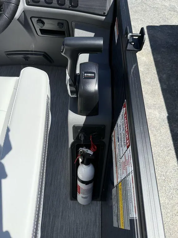 Slide: The Image of Interior of 2026 Bennington S Quad Bench 22 SSR with Yamaha throttle and fire extinguisher. - 20