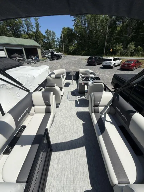 Slide: The Image of 2026 Bennington S Quad Bench 22 SSR pontoon boat with spacious seating and modern design. - 9