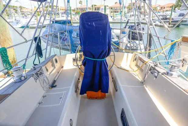 Slide: The Image of Island Packet 40 sailboat cockpit, 1998 model, docked in marina with covered helm. - 30