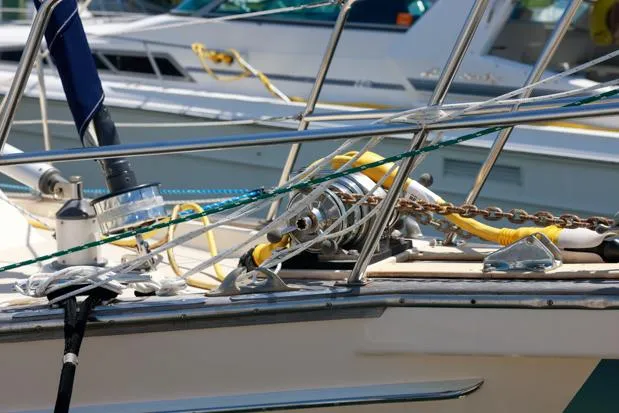 Slide: The Image of Close-up of a 1998 Island Packet 40 sailboat deck with ropes and equipment. - 4