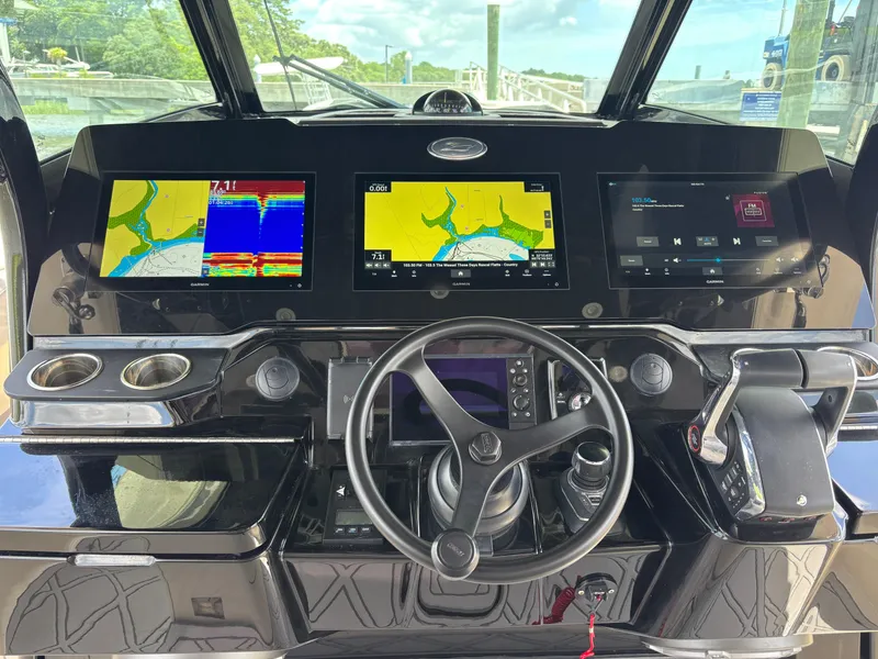 Slide: The Image of 2024 Scout 377 LXF boat dashboard with advanced navigation and control systems. - 9