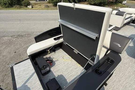 Slide: The Image of 2026 Bennington S Swingback 22 SSB boat interior with open storage compartment. - 16