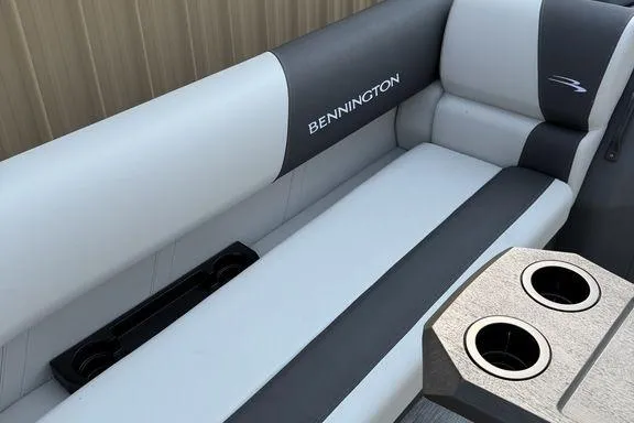 Slide: The Image of 2026 Bennington S Swingback 22 SSB boat interior with sleek seating and cup holders. - 25