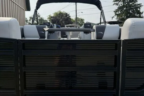 Slide: The Image of 2026 Bennington S Swingback 22 SSB pontoon boat, rear view with sleek black design. - 33
