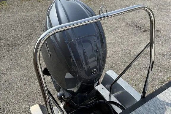 Slide: The Image of 2026 Bennington S Swingback 22 SSB with Yamaha outboard motor, rear view. - 9