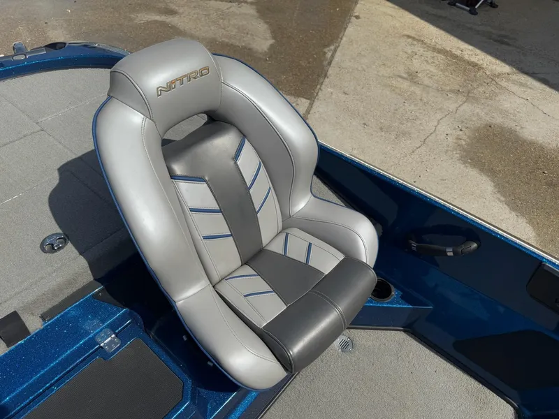 Slide: The Image of 2019 Nitro Z20 boat seat with gray and black upholstery, blue accents, and logo embroidery. - 13