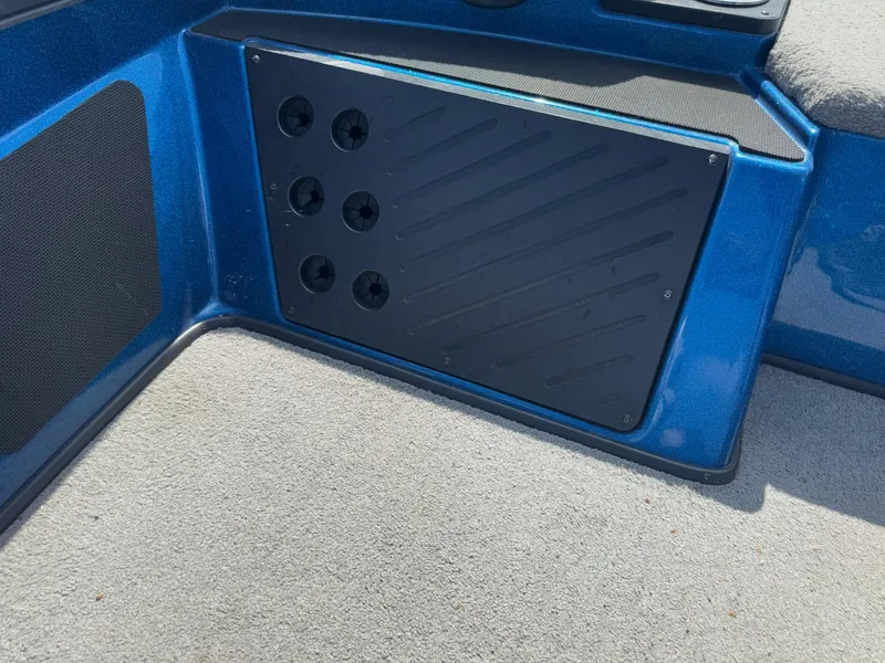 Slide: The Image of Interior of a 2019 Nitro Z20 boat showing a blue panel with ventilation holes. - 14