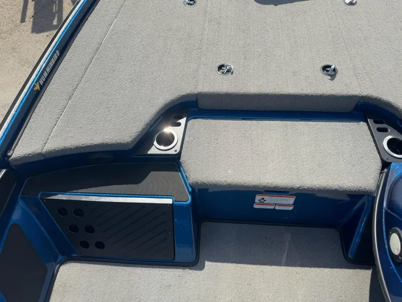 Slide: The Image of 2019 Nitro Z20 boat deck with gray carpet and cup holders. - 15