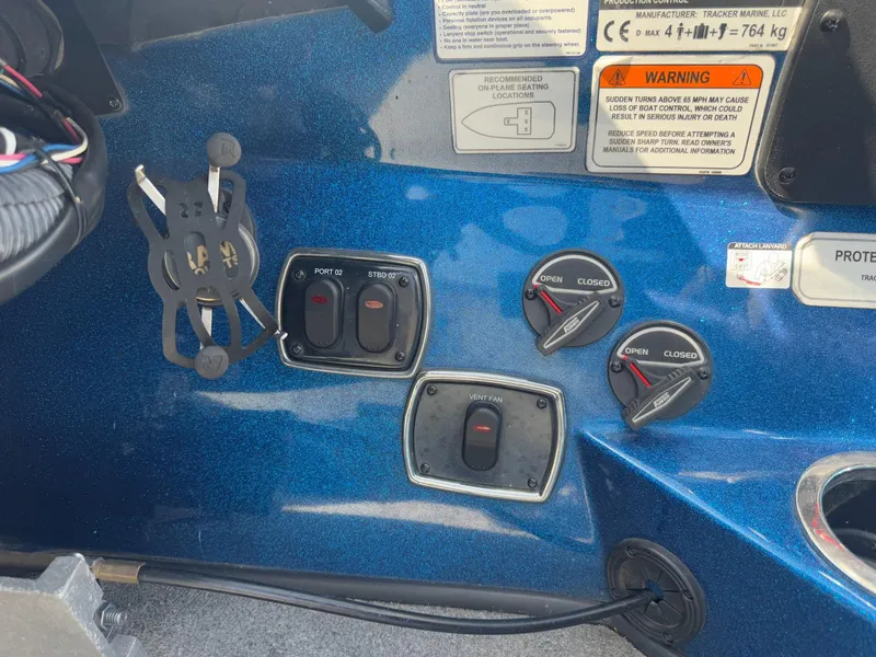 Slide: The Image of Control panel of a 2019 Nitro Z20 boat with switches and warning labels. - 17