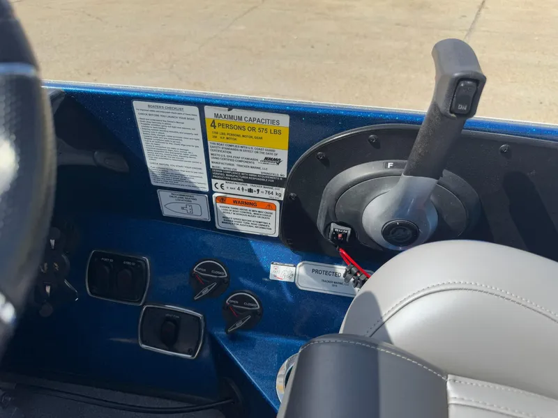 Slide: The Image of Control panel of a 2019 Nitro Z20 boat with capacity and safety labels. - 18