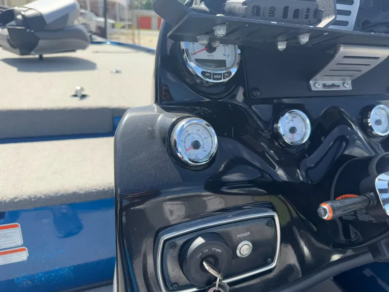 Slide: The Image of Dashboard of a 2019 Nitro Z20 boat with gauges and ignition key. - 23