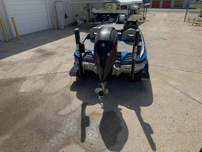 Slide: The Image of 2019 Nitro Z20 boat with outboard motor in a parking area. - 3