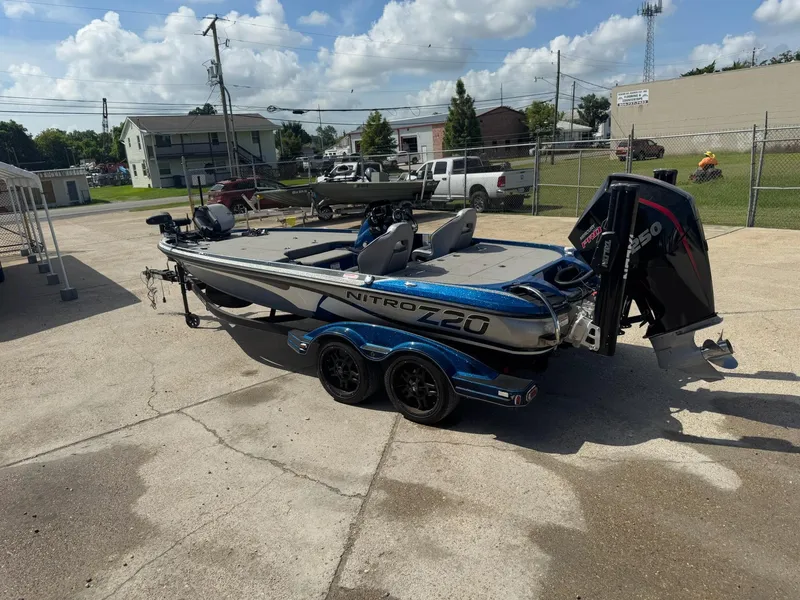 Slide: The Image of 2019 Nitro Z20 boat with powerful engine, parked outdoors on a sunny day. - 4