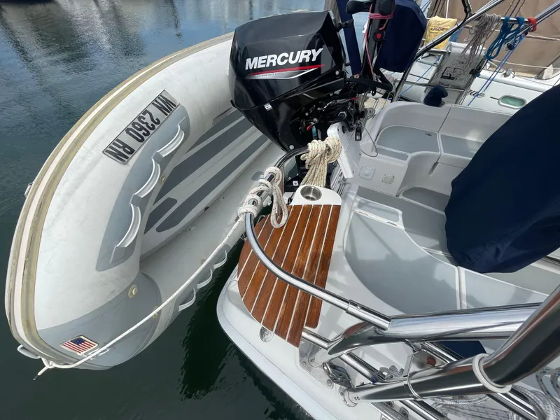 Slide: The Image of Hunter 36 sailboat with Mercury outboard motor and inflatable dinghy, 2004 model. - 10
