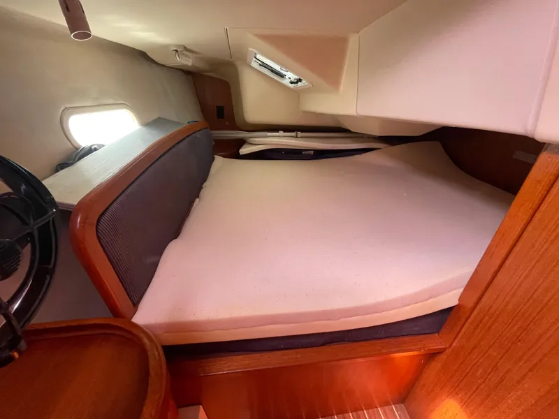 Slide: The Image of Cozy cabin interior of 2004 Hunter 36 sailboat with comfortable bedding. - 16