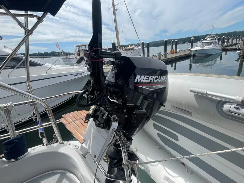 Slide: The Image of Hunter 36 sailboat with Mercury outboard motor docked at marina, 2004 model. - 6