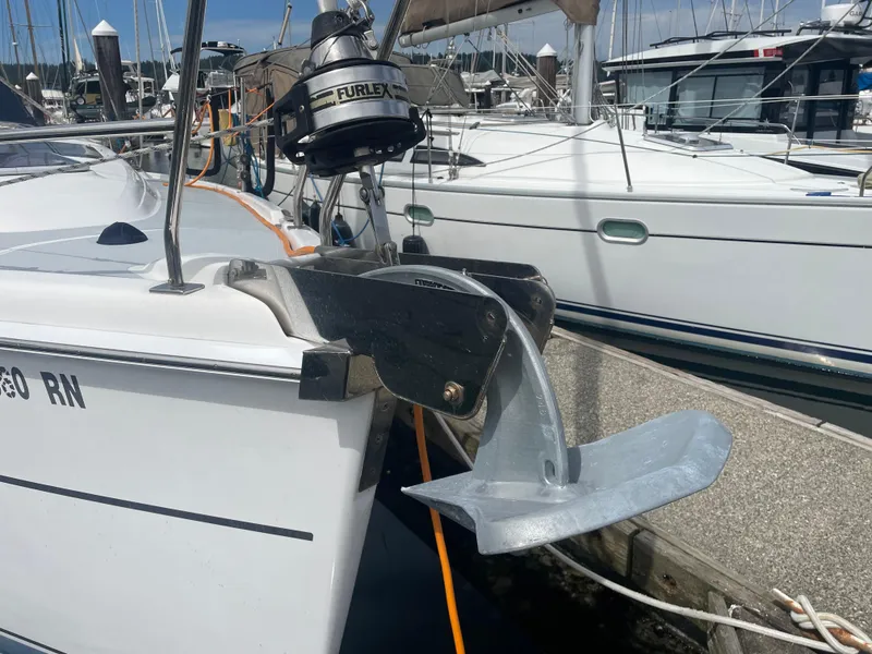 Slide: The Image of Sailboat Hunter 36 (2004) with anchor at marina, featuring Furlex system. - 7