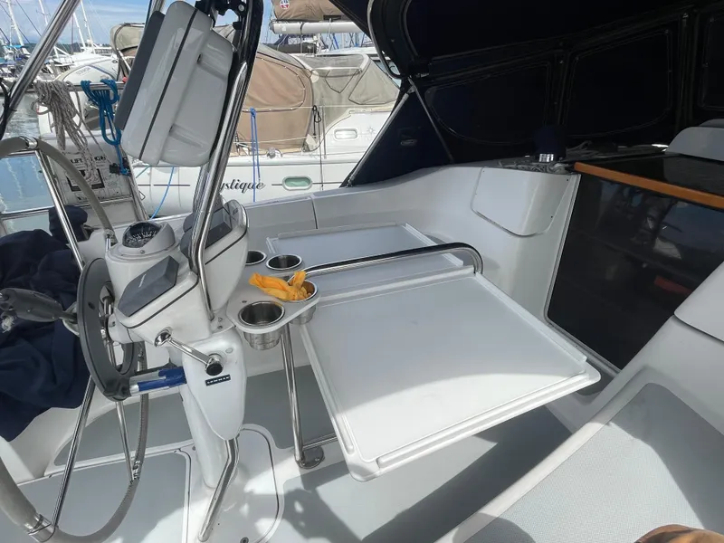 Slide: The Image of Cockpit of 2004 Hunter 36 sailboat with steering wheel and navigation equipment. - 8