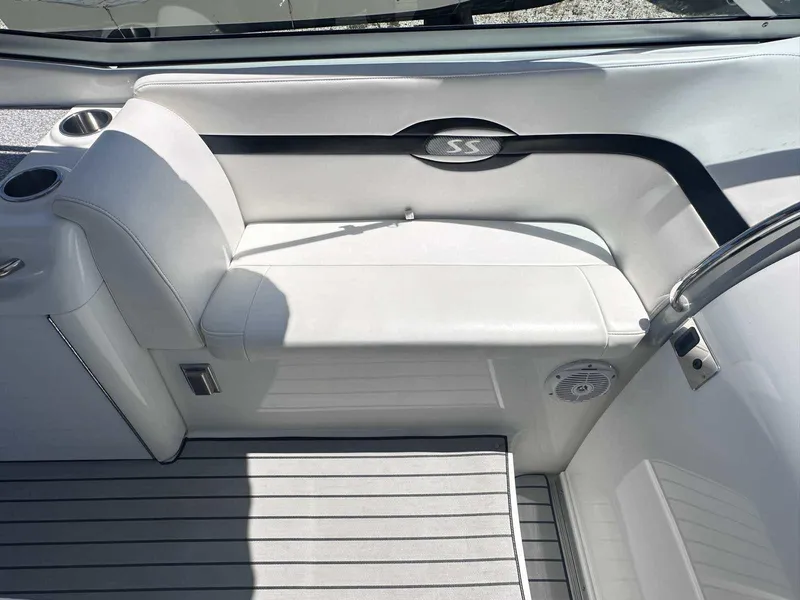 Slide: The Image of 2007 Formula 310 Sun Sport boat interior with white seating and cup holders. - 12