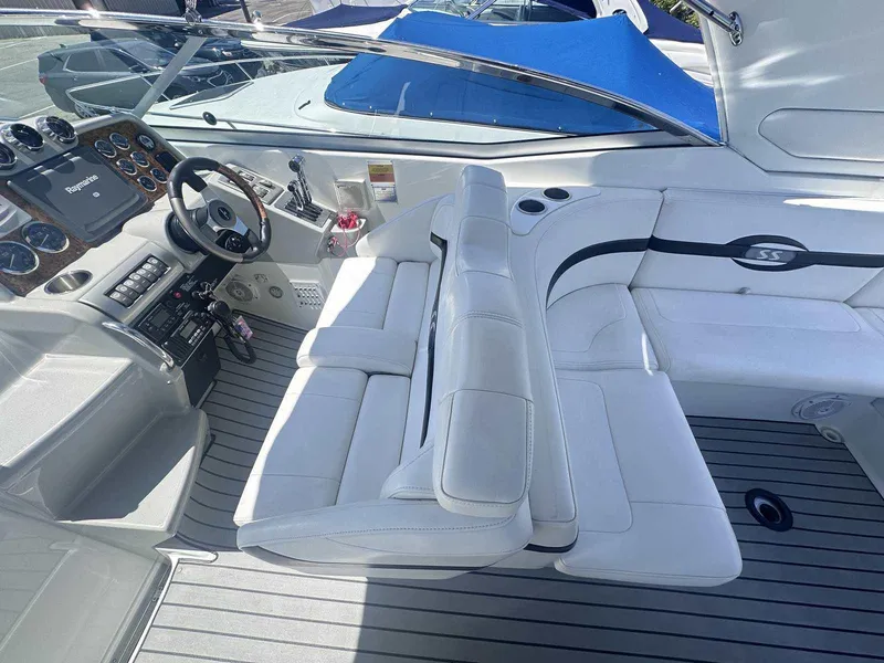 Slide: The Image of 2007 Formula 310 Sun Sport boat interior with white seating and modern dashboard. - 15