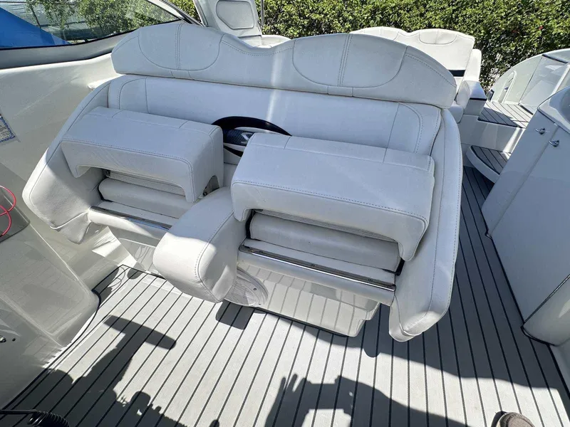 Slide: The Image of 2007 Formula 310 Sun Sport boat interior with white leather seating and sleek design. - 16