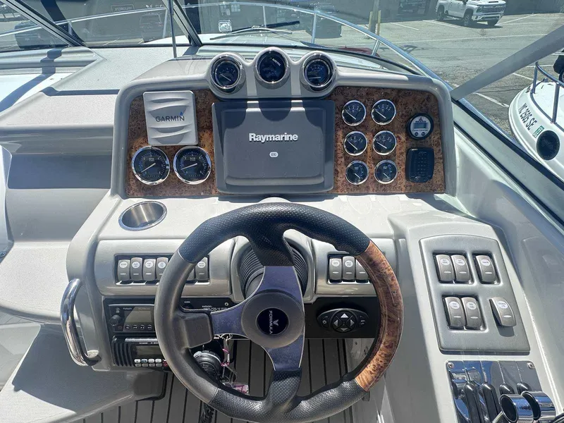Slide: The Image of 2007 Formula 310 Sun Sport dashboard with Garmin and Raymarine navigation systems. - 18